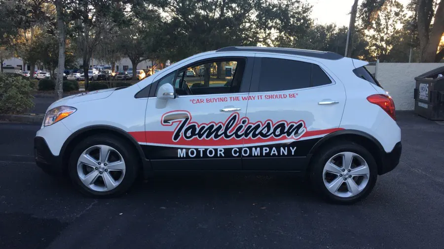 A commercial van fully wrapped in printed vinyl graphics by Cardinal Signs