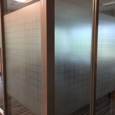 Frosted privacy film with a custom pattern applied to office glass (example 5)