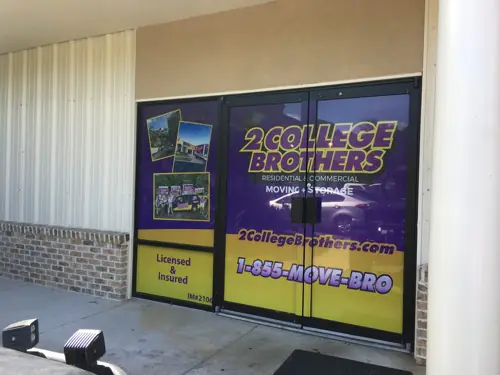Perforated one-way window graphic applied to storefront glass
