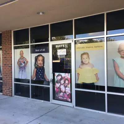Perforated one-way window graphic applied to storefront glass (example 7)