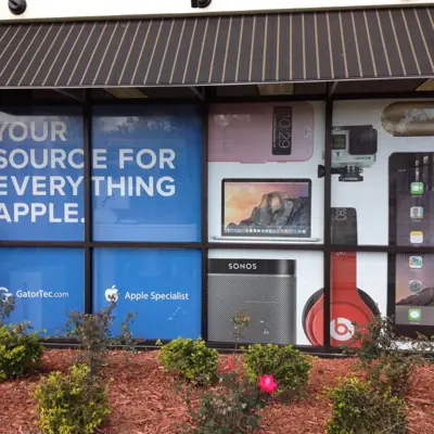 Perforated one-way window graphic applied to storefront glass (example 8)