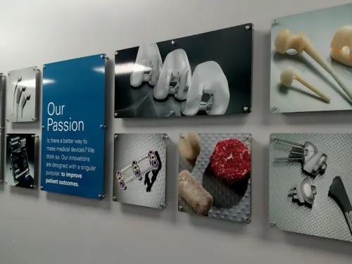 Acrylic lobby panel mounted on polished standoff hardware