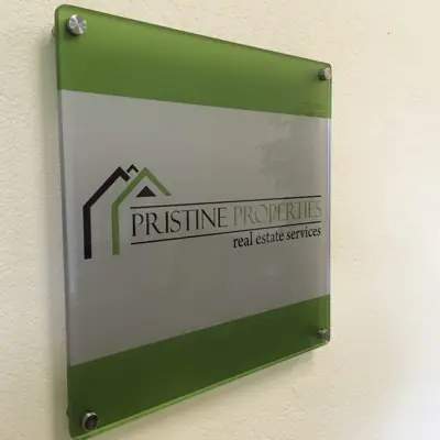 Acrylic lobby panel mounted on polished standoff hardware (example 2)