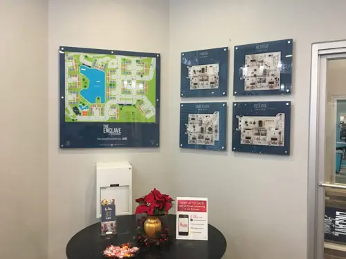 Acrylic lobby panel mounted on polished standoff hardware (example 11)