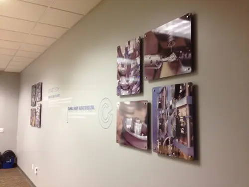 Acrylic lobby panel mounted on polished standoff hardware (example 6)